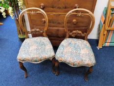 A pair of Victorian dining chairs