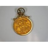 A 9ct gold mounted 1929 22ct full gold sovereign 1