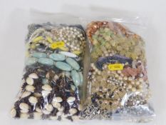 Two bags of decorative costume jewellery