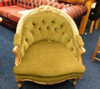 A 19thC. upholstered nursing chair with giltwood f