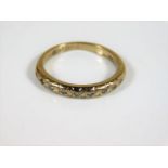 An 18ct gold ring set with small diamonds sie L 2.