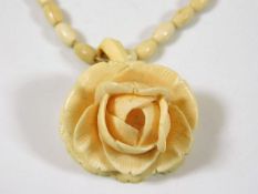 A c.1880 carved ivory rose with necklace 22in long