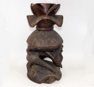 A 19thC. African tribal art carved light wood cere