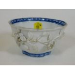 A 19thC. Chinese porcelain spice bowl with applied decor