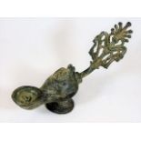 An antique Roman style bronze oil lamp 9.5in long