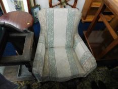 A low level antique nursing chair