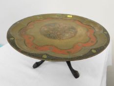 An Anglo Indian brass tray with folding feet