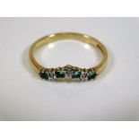A 9ct gold ring set with emerald & diamonds size O