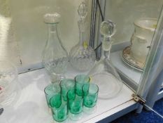 Three glass decanters & six green glasses