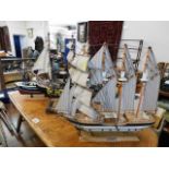 Three model sailboats