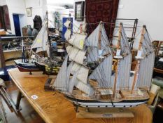 Three model sailboats
