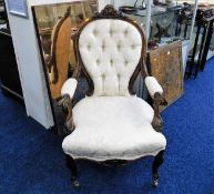 An elegant 19thC. upholstered armchair with button