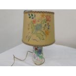 A mid 20thC. Poole Pottery lamp with original hand painted shade, some damage to shade