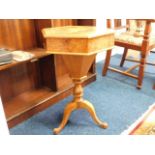 A walnut veneer sewing table