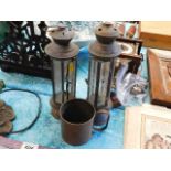 A pair of brass lamps & a copper mug