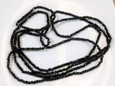 A 1920's jet style flapper necklace 82in long 64.6