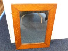 An oak framed mirror