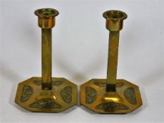 A pair of art nouveau Geschutzt Depose candlestick