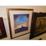 A framed pastel depicting a church & sunset scene