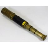 A brass three draw telescope with lens covers, fau