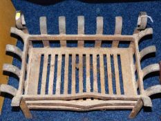 A Georgian style iron fire basket