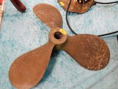 A brass right handed propeller blade