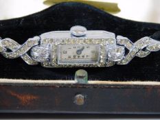 A boxed 1920's silver cocktail watch