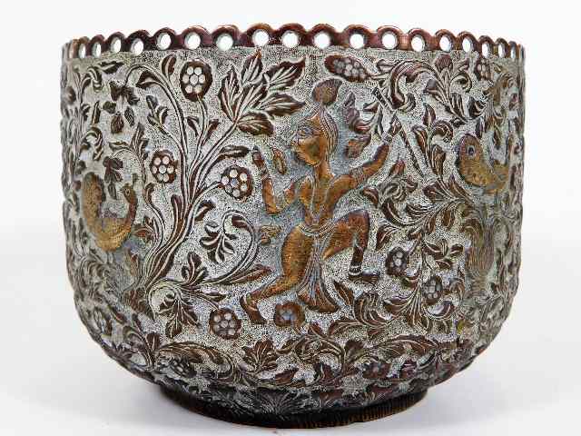 A 19thC. Indian copper bowl with pierced rim & emb