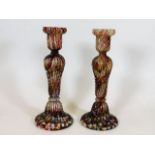 A pair of end of day glass candlesticks 9in high twinned with a pair of reticulated plates