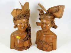 A pair of Balinese hardwood carved busts 12in high