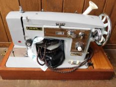 A Read's sail making sewing machine with cover