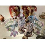 Four German porcelain figures & a half doll