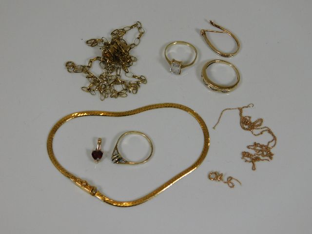 A 9ct gold bracelet, two 9ct gold rings, a 9ct gol