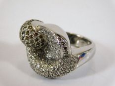 An 18ct white gold designer ring set with approx.