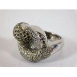 An 18ct white gold designer ring set with approx.