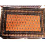 A Persian Bokhara style rug 67in x 48in