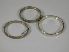 Three silver bangles