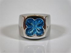 An 18ct white gold designer pinkie ring by Stephen Webster set with blue topaz size F 15.7g
