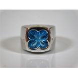 An 18ct white gold designer pinkie ring by Stephen Webster set with blue topaz size F 15.7g