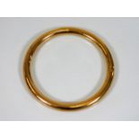 A 9ct gold bangle, couple of small dents 12.3g