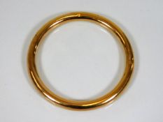A 9ct gold bangle, couple of small dents 12.3g