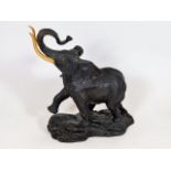 A Franklin Mint bronze elephant with gold plated t