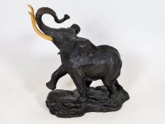 A Franklin Mint bronze elephant with gold plated t