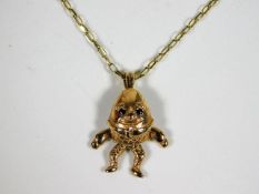 A 9ct gold necklace with novelty humpty dumpty pen