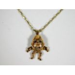 A 9ct gold necklace with novelty humpty dumpty pen