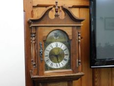 A modern oak long case clock
