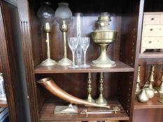 Two brass candle holders, a copper horn, a brass p