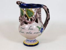 A c.1900 French faience puzzle jug signed PB 6.25I