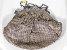 An antique ladies handbag with French hallmark sil