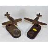 A pair of WW2 wooden spitfires, one lacking glass
